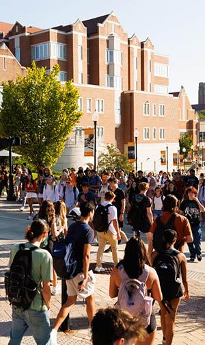 students walk through the middle of campus